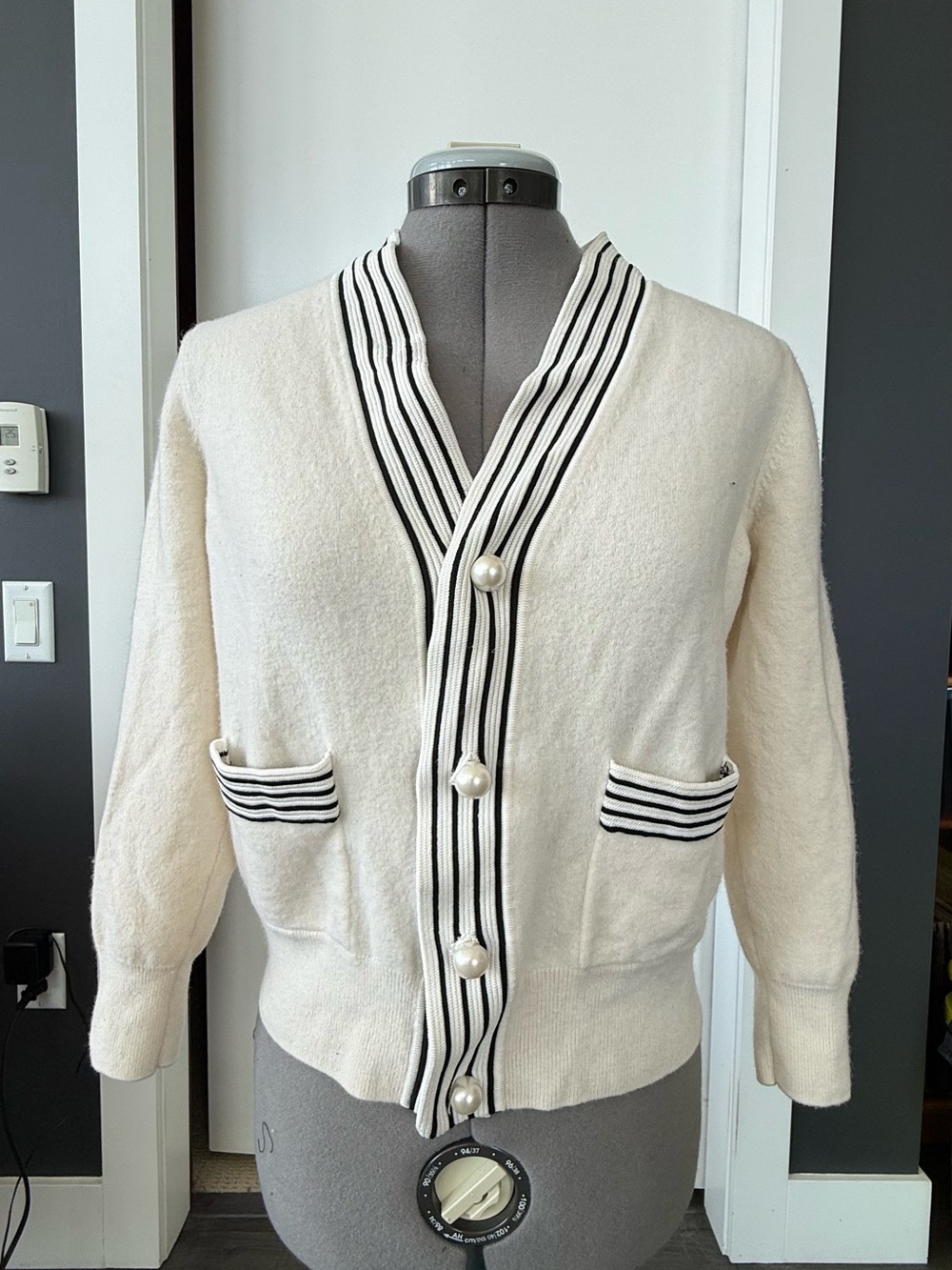 Cream Knit Cardigan with Black Striped Trim and Pearl Buttons